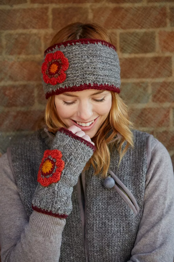Arctic gryde Converge Orvieto Handwarmer Pachamama hand knitted wool fingerless gloves, classic  cable knit and crocheted flower, fair trade and handmade in Nepal.